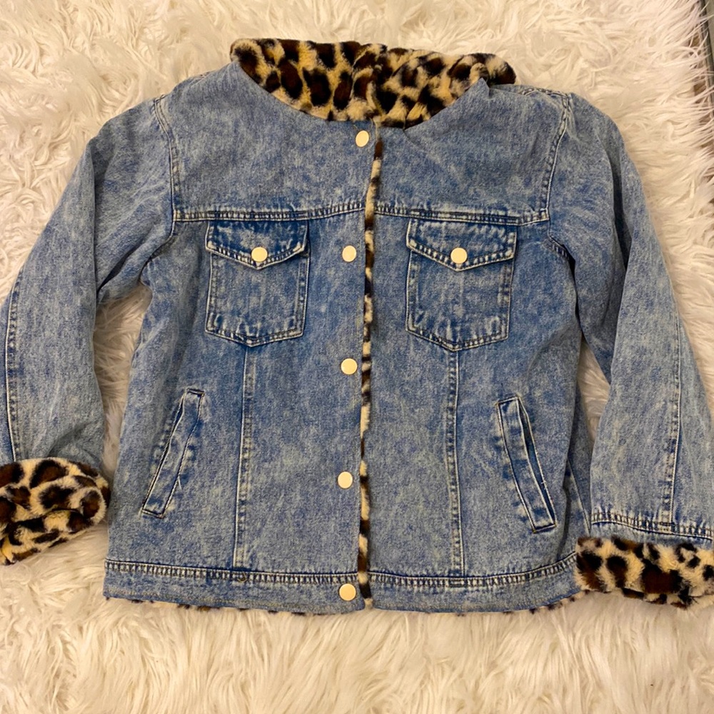 Denim jacket with cheetah print lining.
